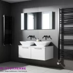 Два черных электрических полотенцесушителей